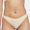 The All-Day Thong: Toasted Almond -Wear Lively Shop 1 on model front all day thong toasted almond
