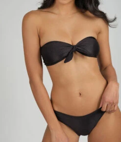 The Ribbed Bandeau & Cheeky Swim Bundle: Jet Black -Wear Lively Shop 3 on model front ribbed tie front bandeau ribbed cheeky swim bundle jet black cf9c298d 921d 45d5 9d42 e7a5aea56215